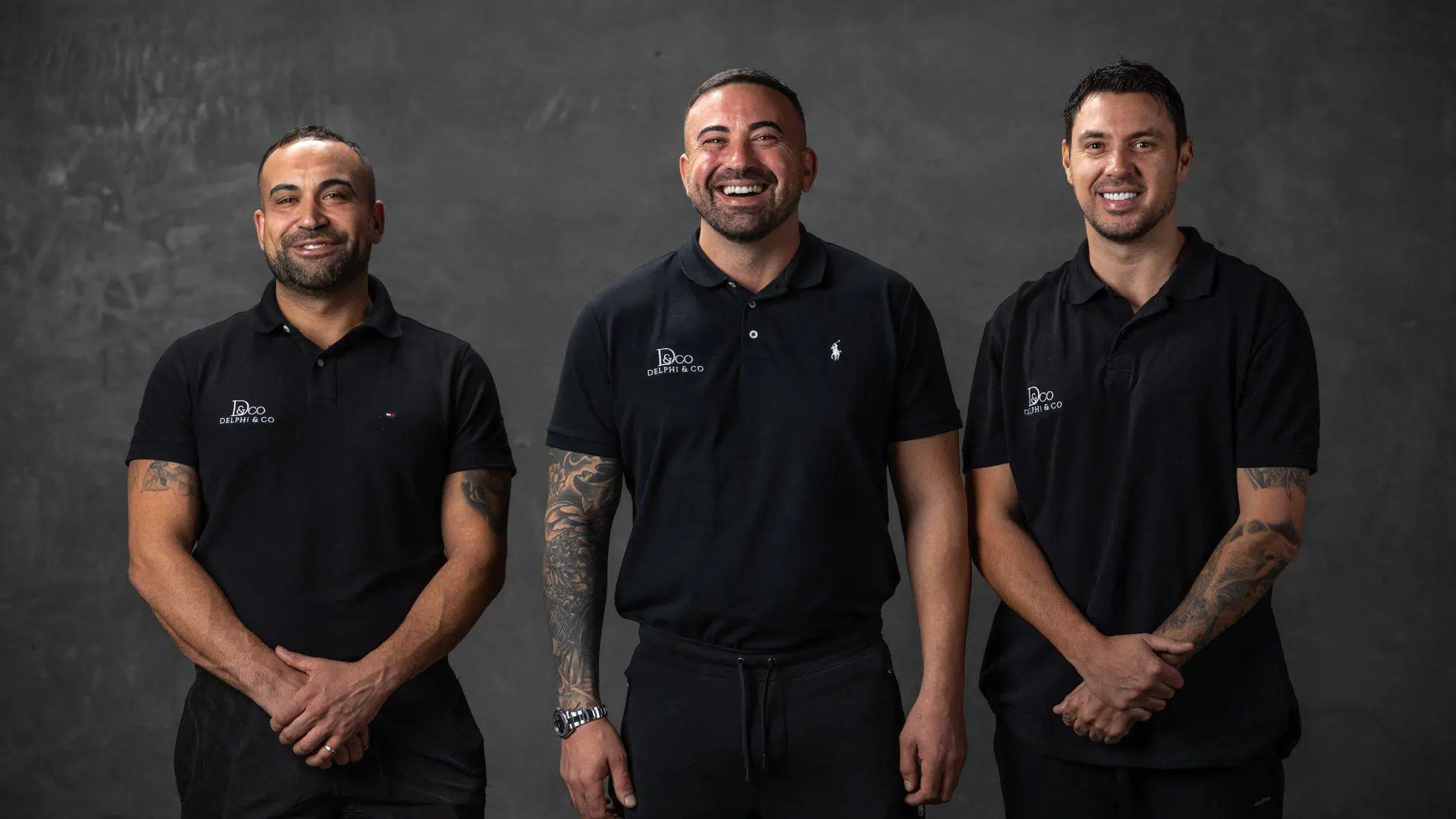 Jamal, Adel and Todd of Delphi & Co standing together, smiling