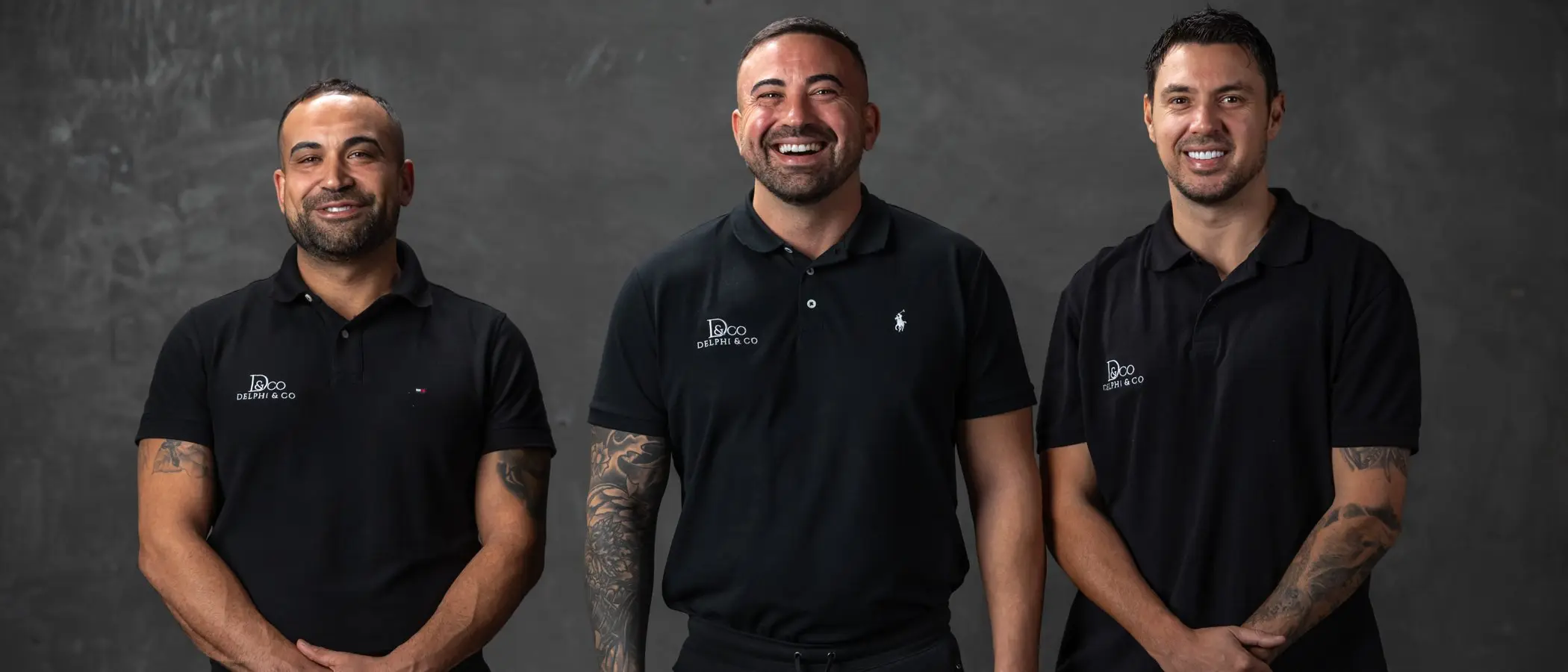 Jamal, Adel and Todd of Delphi & Co standing together, smiling